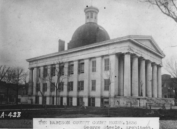 A black-and-white photograph of the Madison County Courthouse taken in 1836.