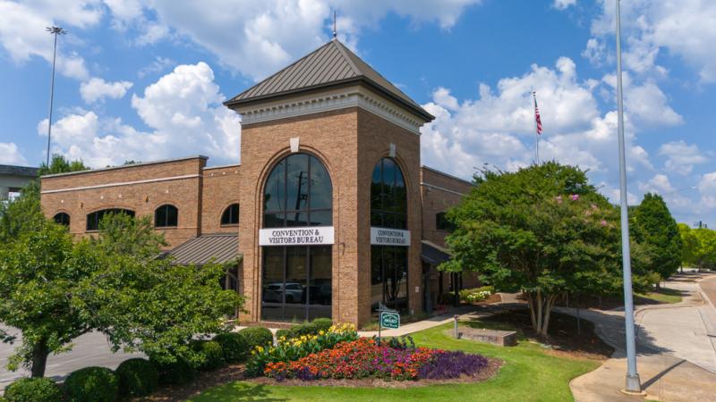 Exterior view of the Huntsville/Madison County Convention & Visitors Bureau building on a sunny day